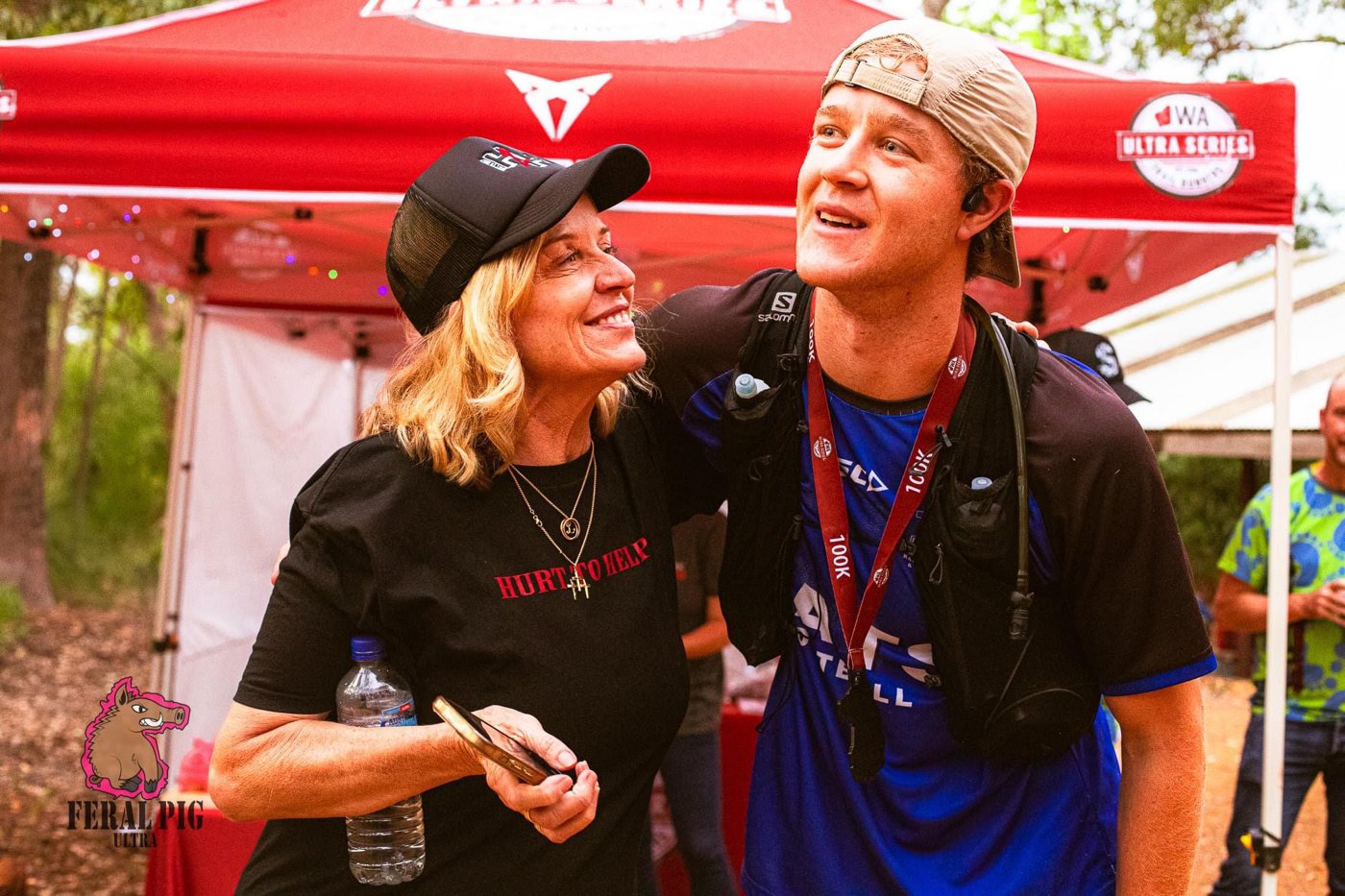 Ethan with a Hurt to Help supporter after finishing a 100 km ultra