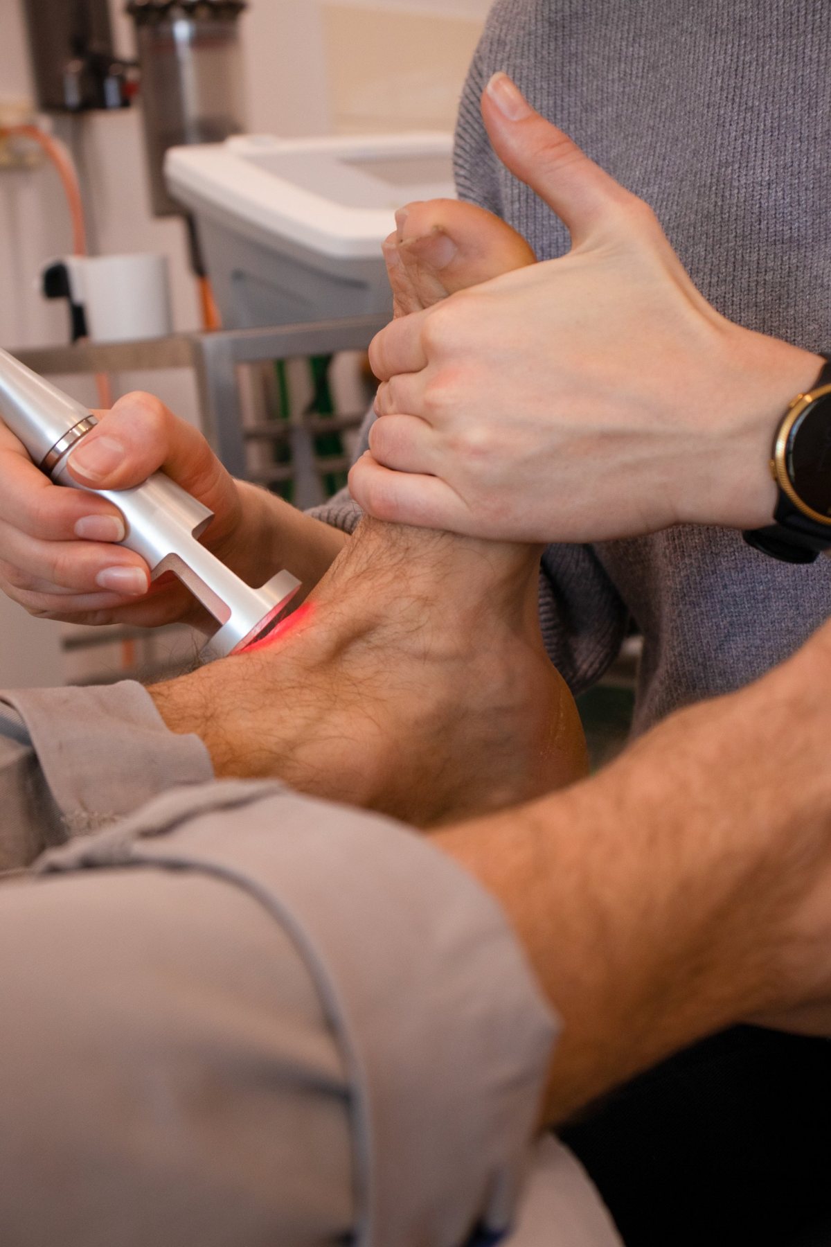 Laser therapy being applied to an ankle at The Foot Studio