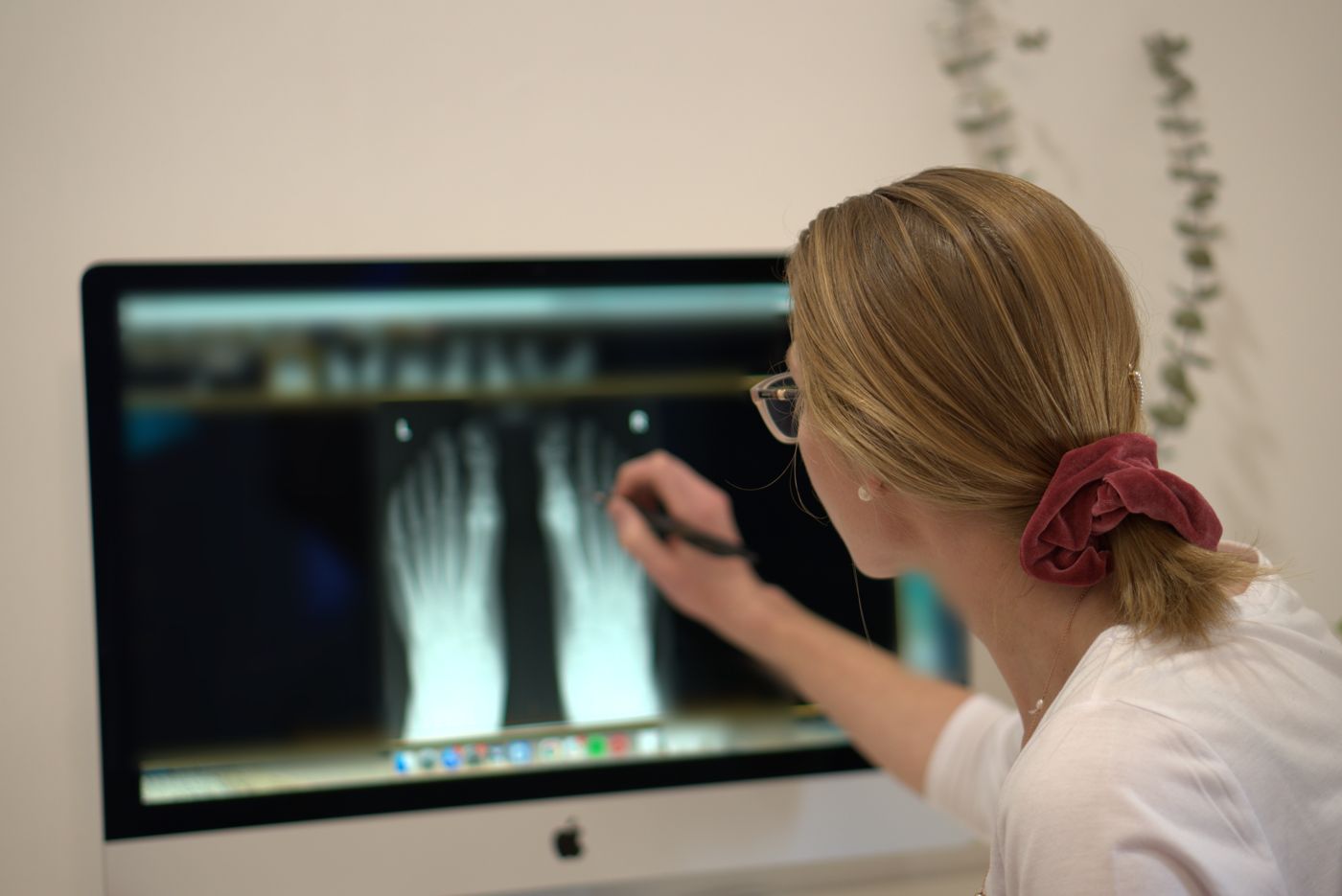 A podiatrist reviewing a foot X-ray